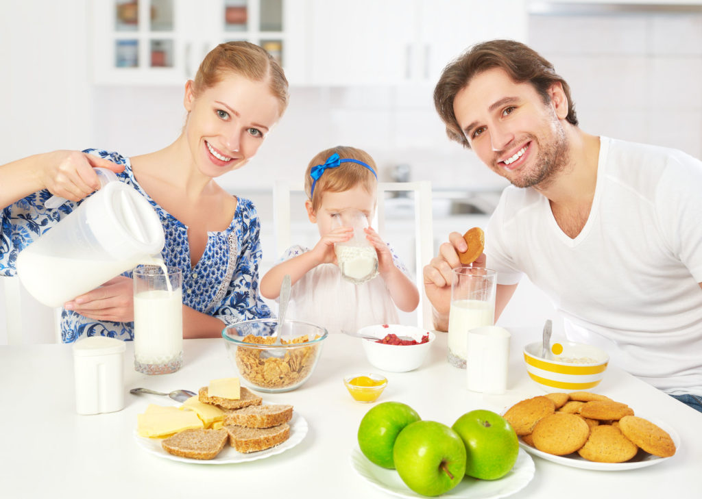 Weaned child eating with the family